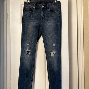 Skinny jeans with ripped gold detail